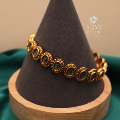 Antique Gold Peacock Eye Bangle with Traditional Design