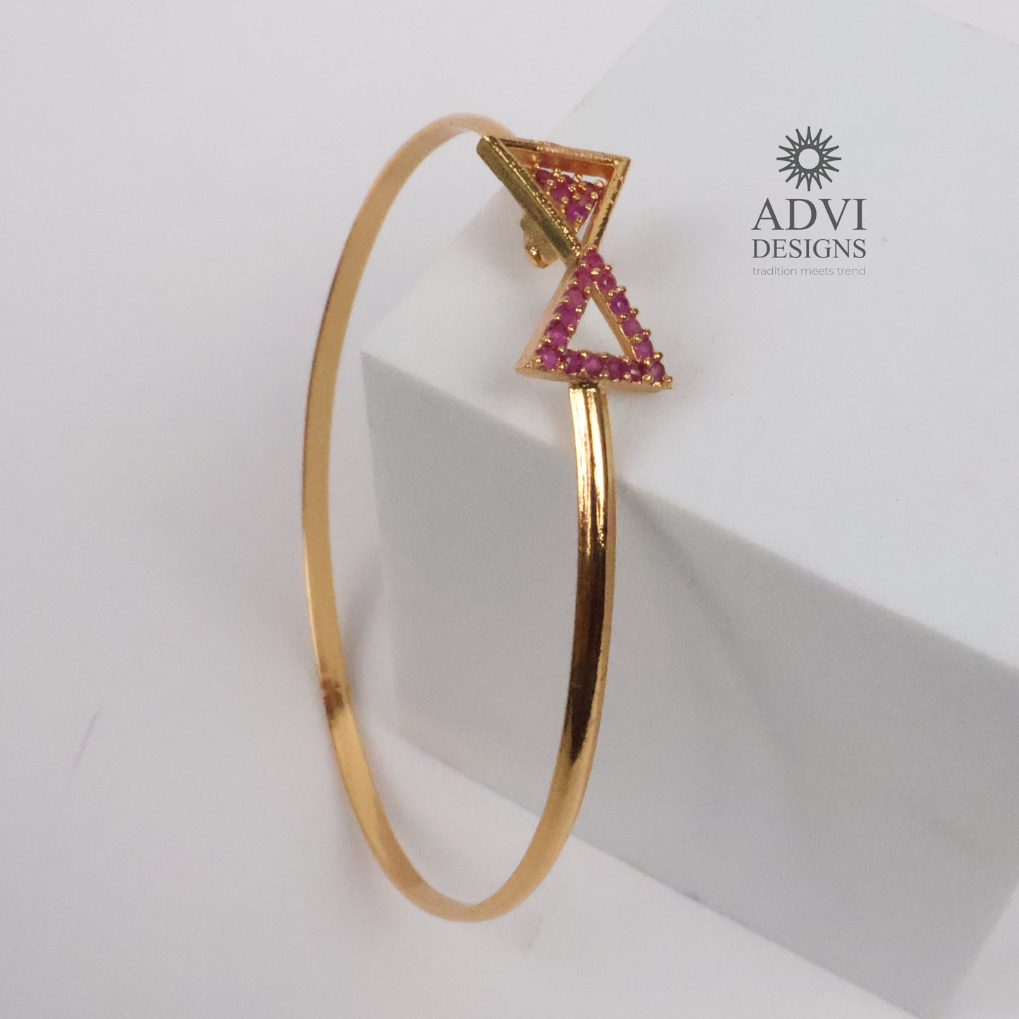 Gold-Tone Geometric Triangle Bangle with Pink Stone Detailing