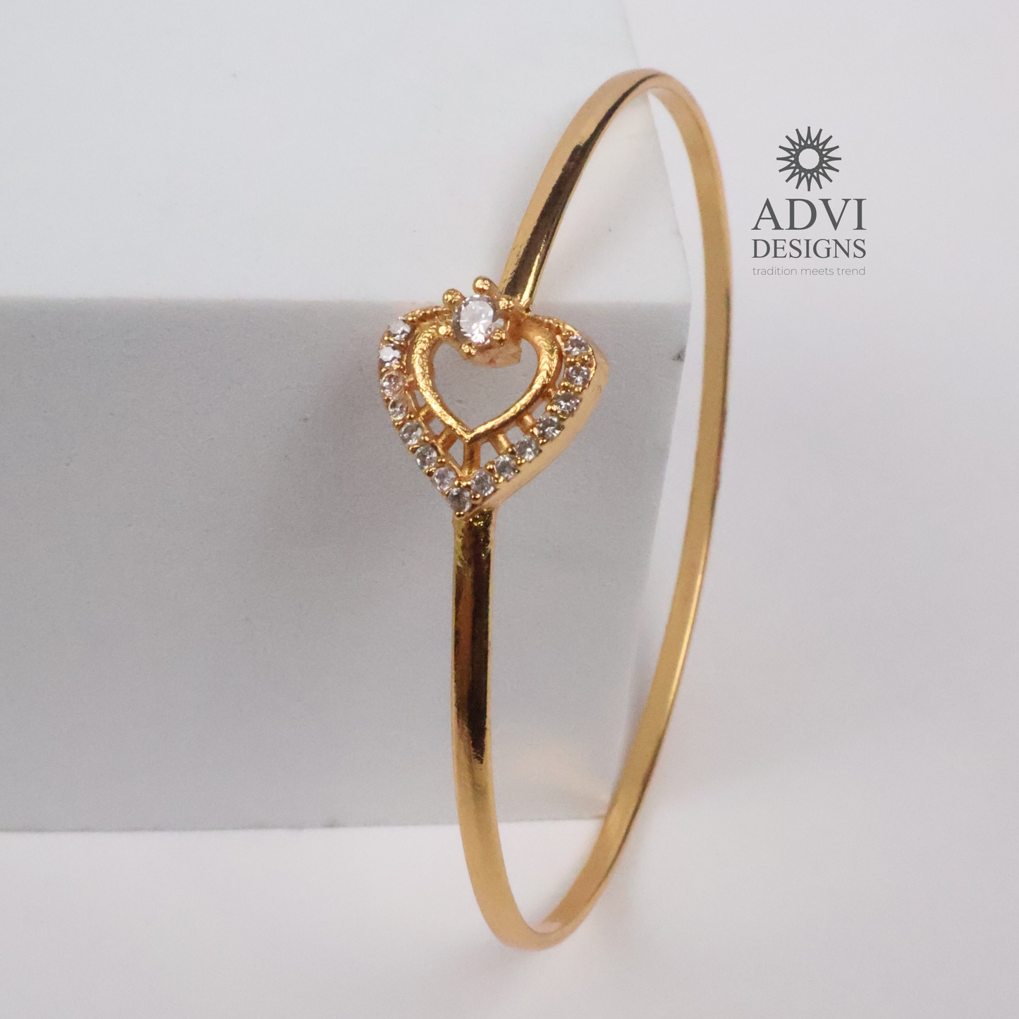 Gold-Tone Heart-Shaped Crystal Bangle with Double Heart Detail