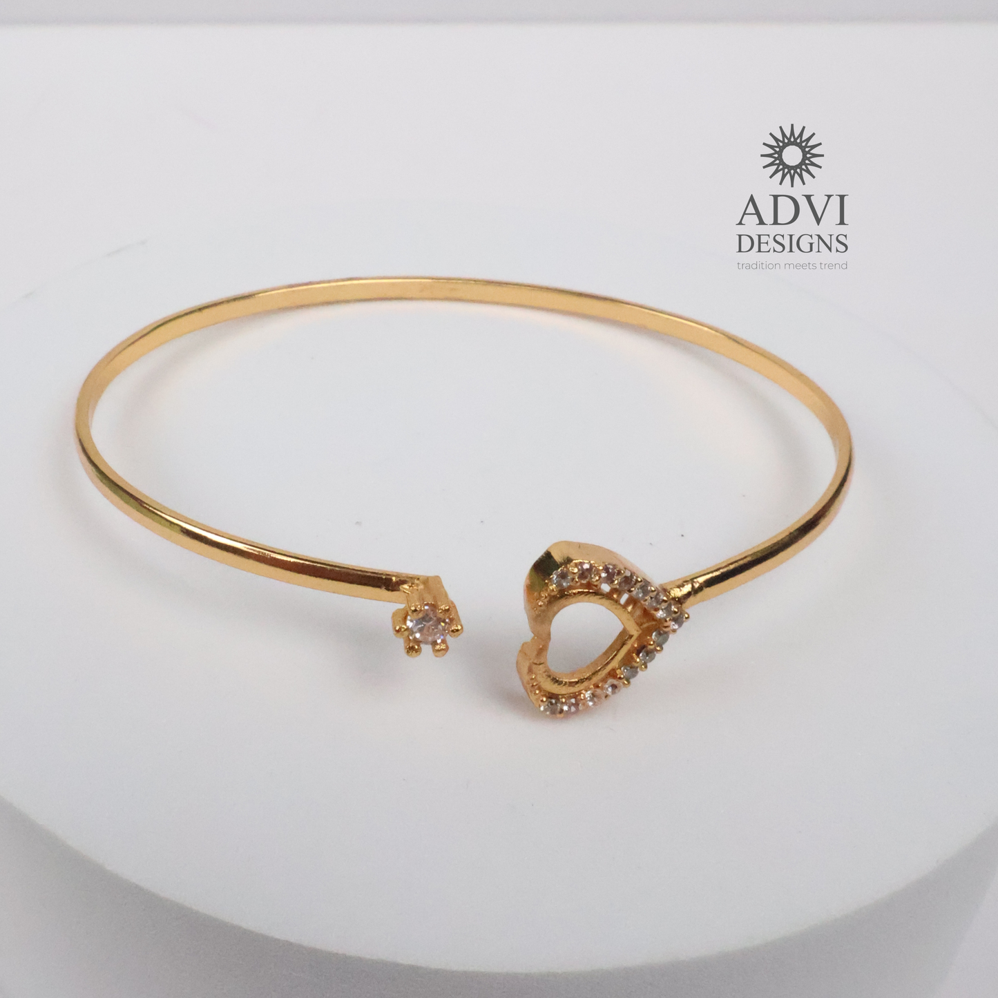 Gold-Tone Heart-Shaped Crystal Bangle with Double Heart Detail