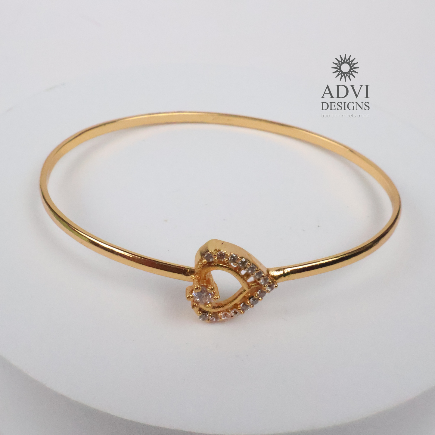 Gold-Tone Heart-Shaped Crystal Bangle with Double Heart Detail