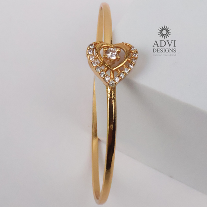 Gold-Tone Heart-Shaped Crystal Bangle with Double Heart Detail