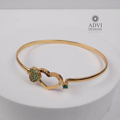 Gold-Tone Heart Bangle with Green Stone Floral Cluster