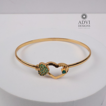Gold-Tone Heart Bangle with Green Stone Floral Cluster