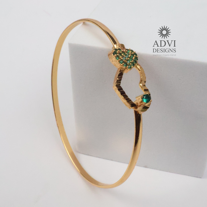 Gold-Tone Heart Bangle with Green Stone Floral Cluster