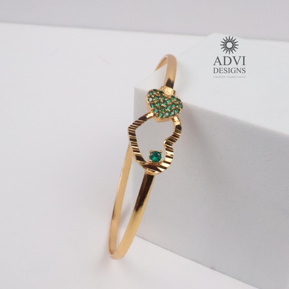 Gold-Tone Heart Bangle with Green Stone Floral Cluster