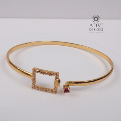 Gold-Tone Geometric Square Bangle with Ruby-Colored Stone & CZ Detailing