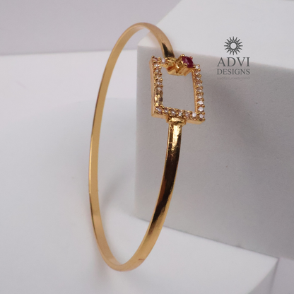 Gold-Tone Geometric Square Bangle with Ruby-Colored Stone & CZ Detailing