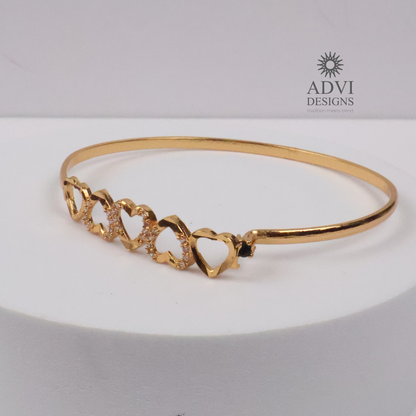 Gold-Tone Multi-Heart Bangle with Crystal Detailing & Black Stone Accent