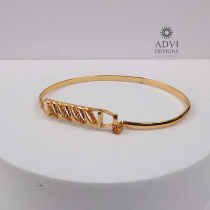 Gold-Tone Geometric Bangle with Diagonal Crystal Detailing & Orange Stone