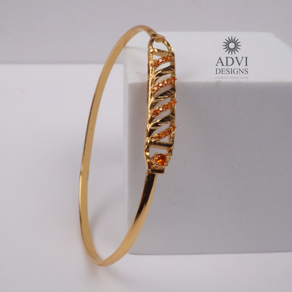 Gold-Tone Geometric Bangle with Diagonal Crystal Detailing & Orange Stone