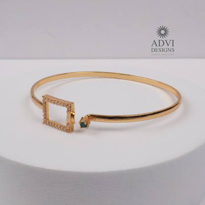 Gold-Tone Geometric Bangle with Green Stone & Crystal Detailing