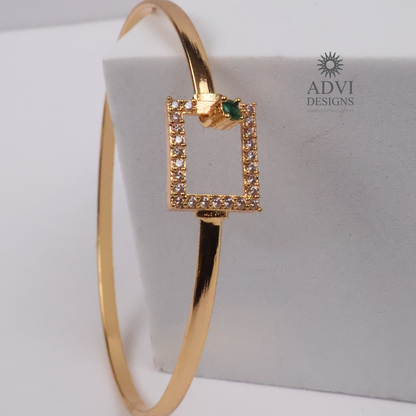 Gold-Tone Geometric Bangle with Green Stone & Crystal Detailing