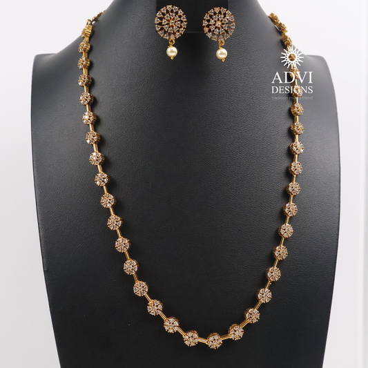 Premium AD Stone Floral Long Necklace Set with Pearl Drop Earrings | Antique Gold Finish